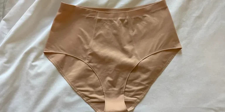 High waist support briefs laid flat on bedding