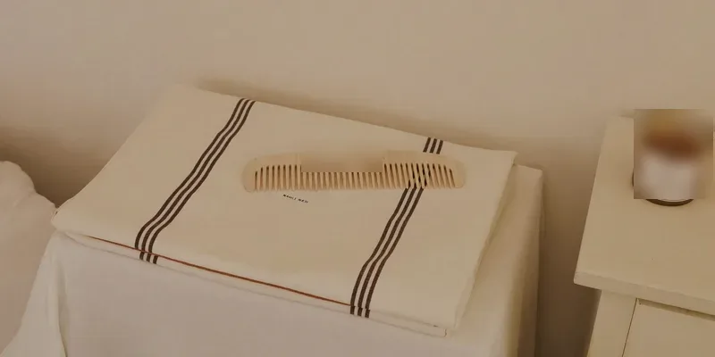 Smooth wooden comb on a folded linen cloth