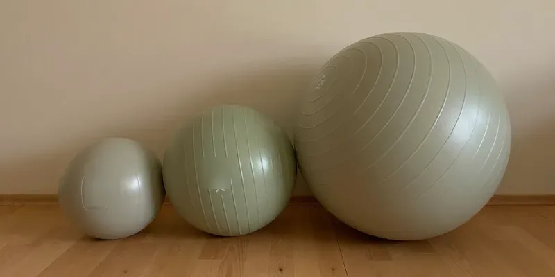 Three exercise balls in different sizes in a row