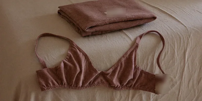 Ultra soft heather mauve wireless bra on a bed