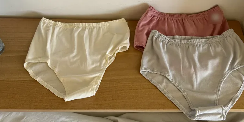Stack of soft high waist briefs on a shelf