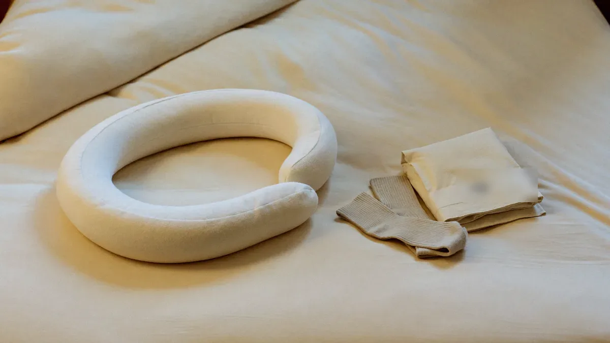 Pregnancy pillows compared on a bed
