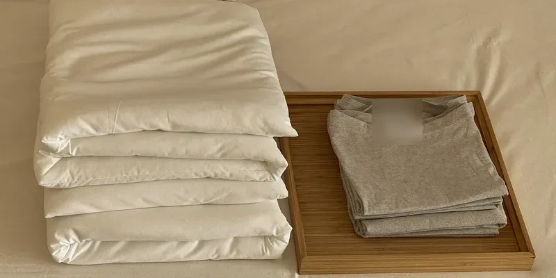 Stack of cotton pads beside folded briefs