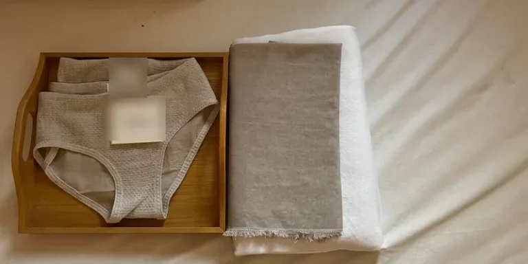 Stack of soft mesh briefs on a wooden tray