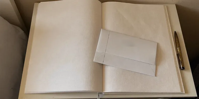 Cream linen journal with envelope and brass pen