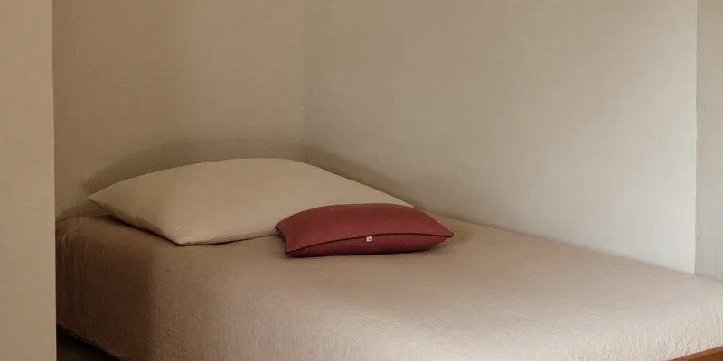 Compact wedge and knee pillow on a narrow bed