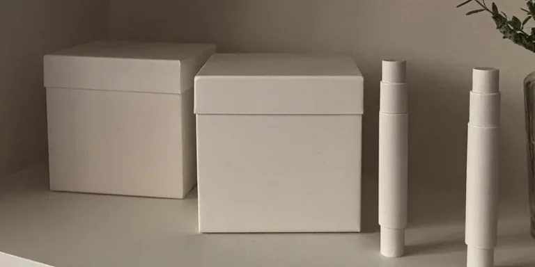 Two blank white boxes with plain white sticks