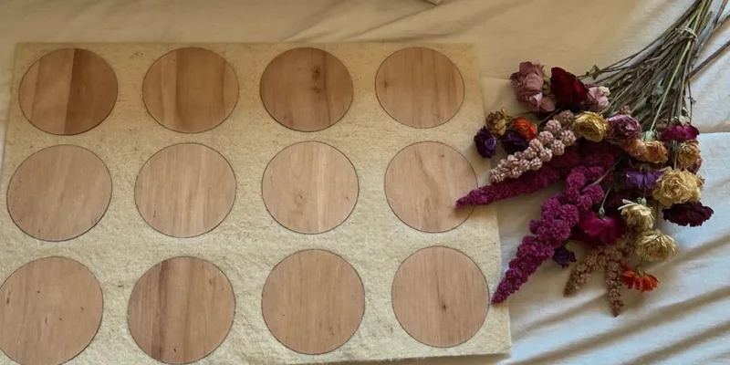 Blank wooden discs and empty letter board on a bed